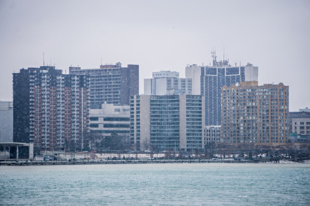 downtown windsor canada city skyline across river in spring winter stormの素材 [FY31079873074]