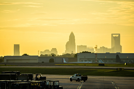 Sun rising early morning over charlotte skyline seen from clt airportのeditorial素材