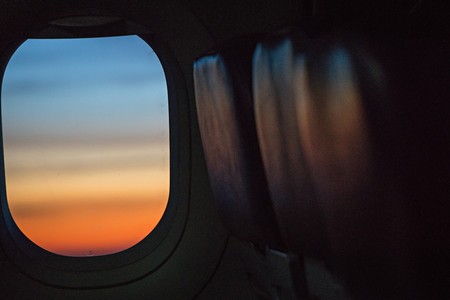 colorful sunrise in airplane windowの写真素材