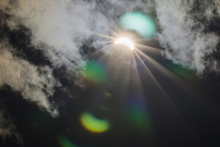 Partial Solar Eclipse Through Cloudsの写真素材
