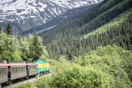 SKAGWAY, ALASKA, USA - JUNE 2017 - Alaskan Canadian White Pass train ride attraction through british columbia canadian rocky mountainsのeditorial素材