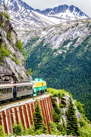 SKAGWAY, ALASKA, USA - JUNE 2017 - Alaskan Canadian White Pass train ride attraction through british columbia canadian rocky mountainsのeditorial素材