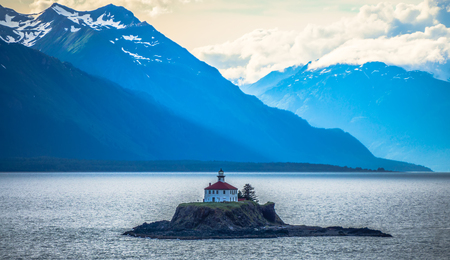 remote lighthouse island standing in the middle of mud bay alaskaの写真素材