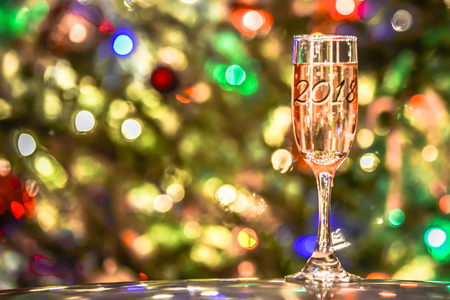 Champagne or wine 2018 glass  on sparkling backgroundの写真素材