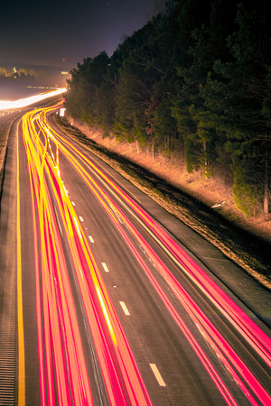super highway with high volume of cars at night