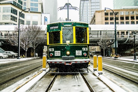 streetcar waiting for passengers in snowstrom in uptown charlotte north carolinaのeditorial素材