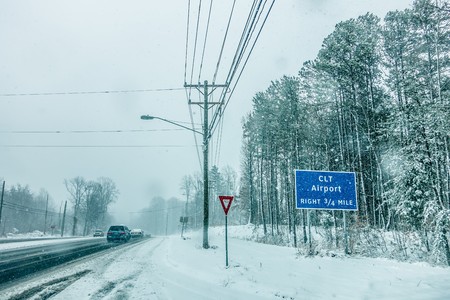 snowy weather conditions around charlotte airport in north carolinaの写真素材