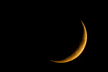 new moon on dark skyの写真素材