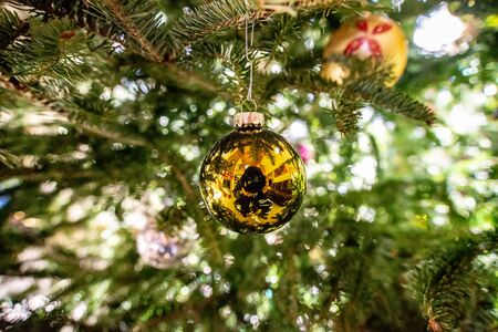 Selective focus of beautiful decorated christmas tree with shiny baublesの写真素材