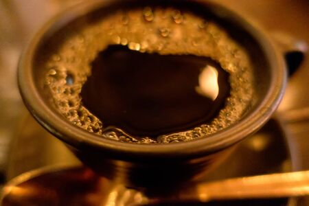 cup of dark coffee espresso on  wooden tableの写真素材