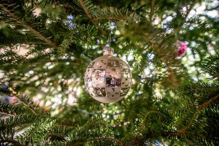 Selective focus of beautiful decorated christmas tree with shiny baublesの写真素材