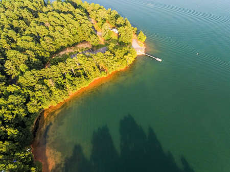 aerial over lake hartwell south carolina and georgia line at sunsetの写真素材