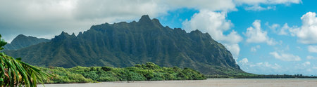 Panorama of tropical lagoon, lush mountains,  and the ocean in Oahu, Hawaiiの写真素材