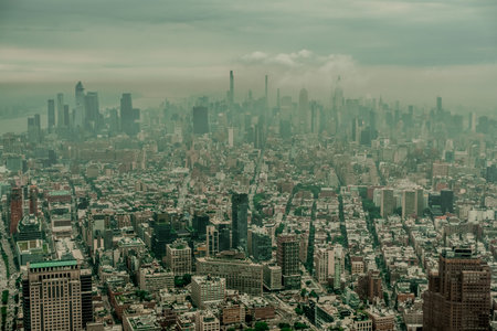 New York City Manhattan midtown aerial panorama view with skyscrapers and cloudy day.の写真素材