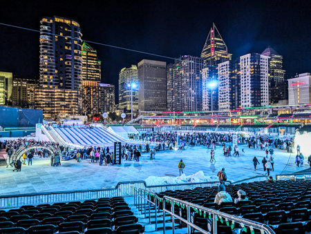 Charlotte, North Carolina, USA - DECEMBER 2024: Holiday ice skating rink and Christmas decorations in Uptown Charlotte at night
