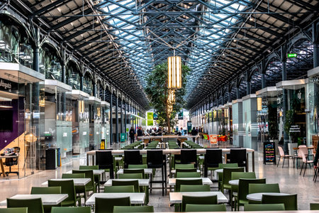 CHQ Building Interior Dublin Ireland with Glass Roof Steel Structure and Modern Food Hall Seating in Historic Warehouse Space