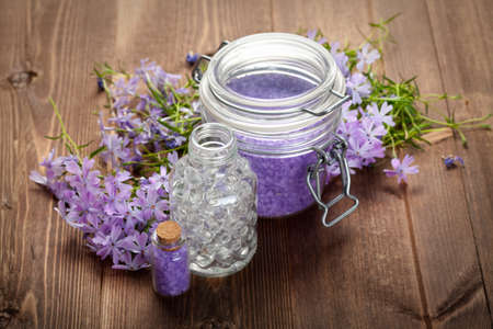 Spa still life - bath salt and spring flowersの写真素材