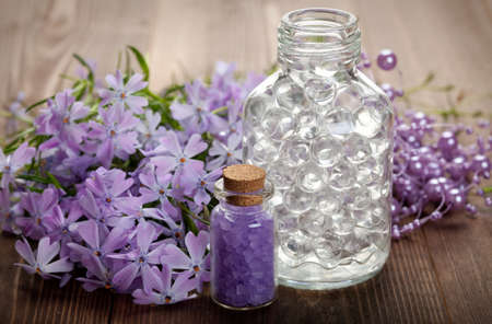 Aromatherapy and Spa - bath salt and flowersの写真素材
