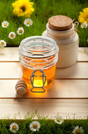 Honey and spring flowersの写真素材