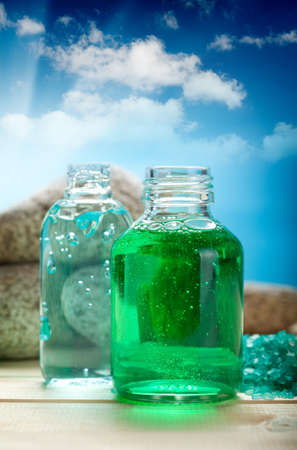 Aromatherapy oils on blue sky backgroundの写真素材