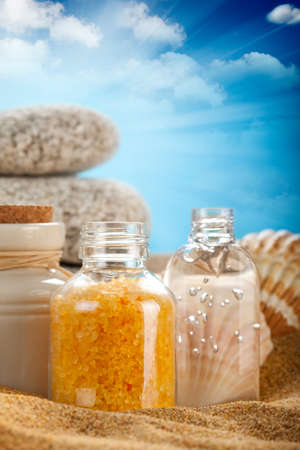Orange bath salt on sandの写真素材