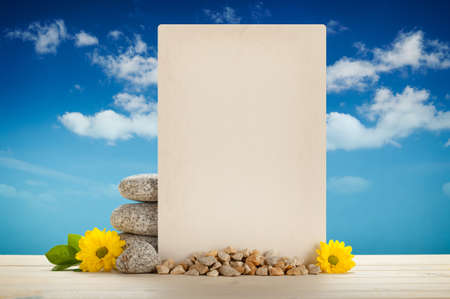 Blank card, stones and flowersの写真素材