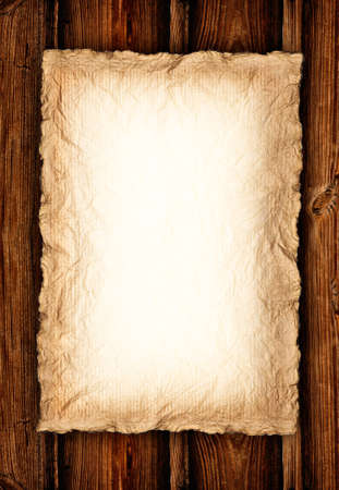 Background - Old crumpled paper on wood の写真素材