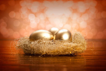 Easter eggs - Golden eggs in the nestの写真素材