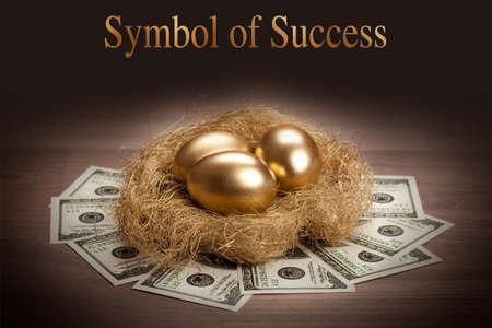 Symbol of Success - three golden eggsの写真素材
