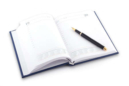 Agenda and pen on white backgroundの写真素材