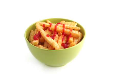 Chips with ketchup in green bowl isolated on white