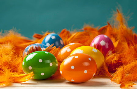 Easter eggs on feather background