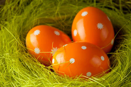 Orange Easter eggs in the nest