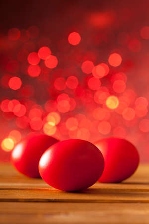 Three Easter eggs on red backgroundの写真素材