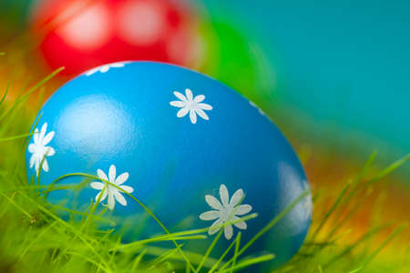 Colored Easter eggs on the grass
