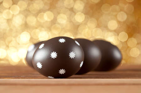 Easter eggs on gold backgroundの写真素材