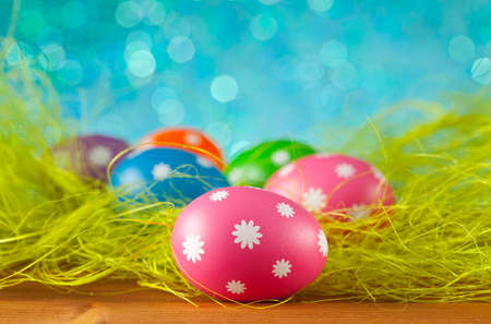 Colored Easter eggs on blue background