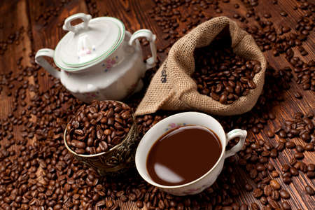 Coffee cup, beans and canvas sack
