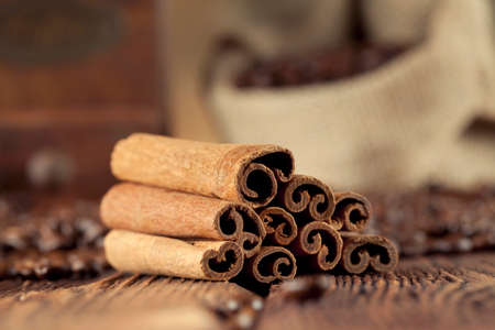 Cinnamon sticks, coffee grains and old grinderの写真素材