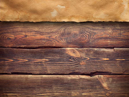 Creased paper sheet on wooden wall backgroundの写真素材