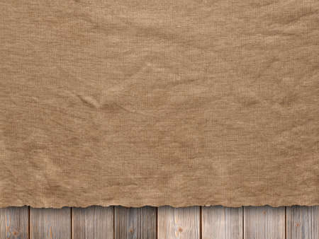 Creased fabric on wooden wall backgroundの写真素材