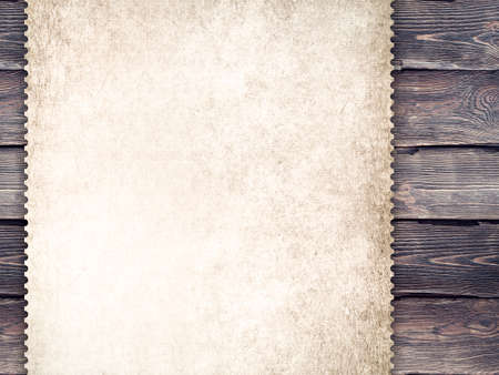 Handmade paper sheet on old wood plank wall backgroundの写真素材