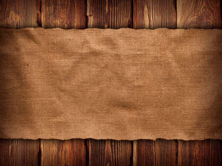 Creased fabric on wooden wall backgroundの写真素材