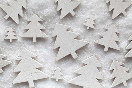 Wooden Christmas trees on snowの写真素材