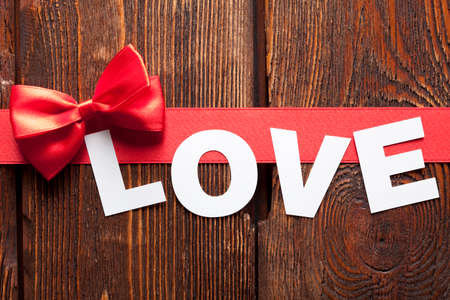 Inscription Love on wooden tableの写真素材