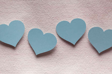 Four blue paper heartsの写真素材