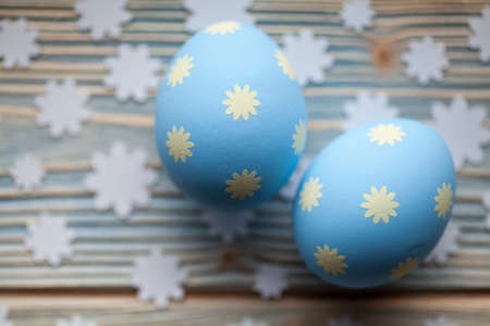 Two Easter eggs on wooden tableの写真素材