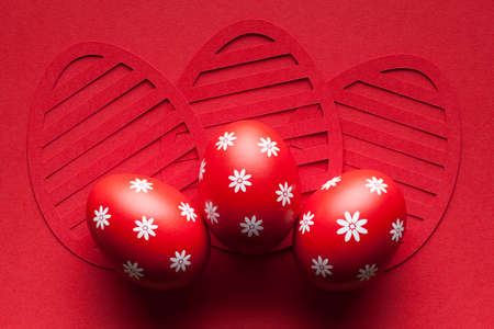 Three Easter eggs on paper background