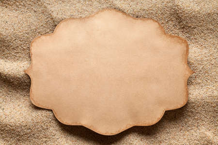 Blank paper card on the beachの写真素材