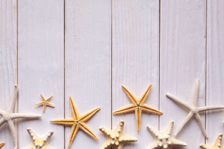 Starfishes on wooden tableの写真素材